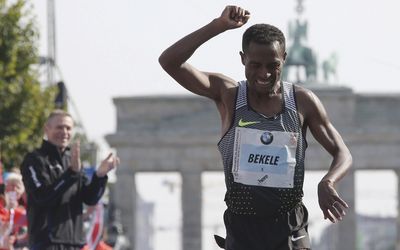 Ethiopia’s Kenenisa Bekele edges near-record win in Berlin